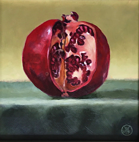 Painting of a pomegranate cut with a knife on a green table cloth by Davette Leonard at Cottage Curator art gallery Sperryville VA