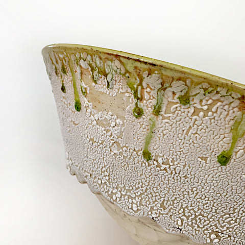 Ceramic bowl with lime green interior and white/tan exterior with drops of green running over the edges from the interior by Virginia Rood Pates at Cottage Curator - Sperryville VA