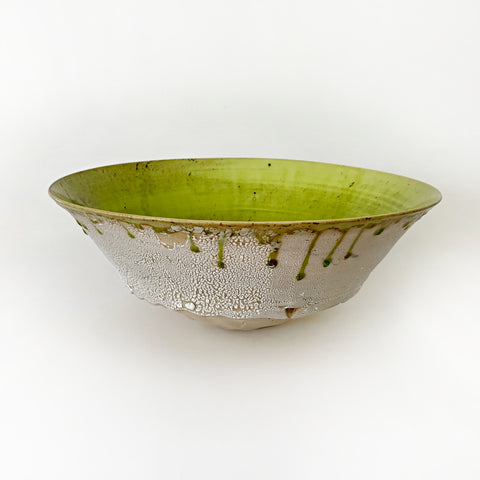 Ceramic bowl with lime green interior and white/tan exterior with drops of green running over the edges from the interior by Virginia Rood Pates at Cottage Curator - Sperryville VA