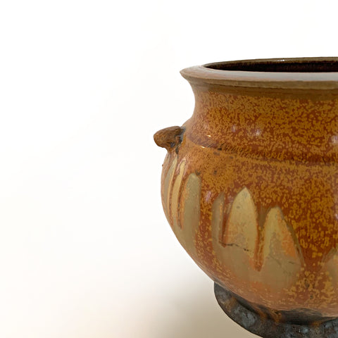 Detail of one side of a vessel with wide mouth and two handles glazed in ochre and gray with a dark brown interior by Richard Aerni at Cottage Curator - Sperryville VA Art Gallery