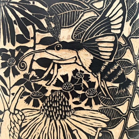 Detail of hummingbird moth and snail on black and white terra sigillata and sgraffito jar with lid edged in pine needles by Carolyn Blazeck at Cottage Curator - Sperryville VA Art Gallery