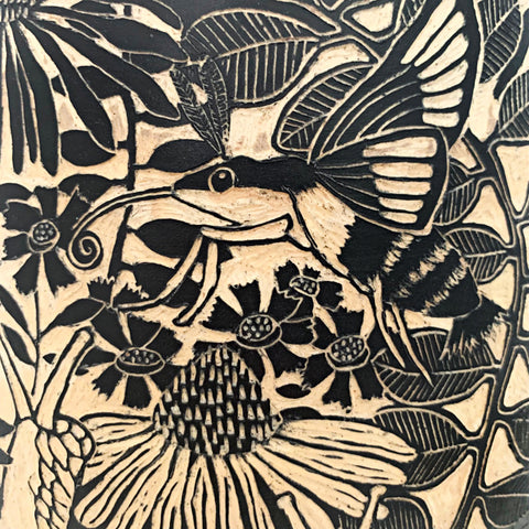 Detail of hummingbird moth and snail on black and white terra sigillata and sgraffito jar with lid edged in pine needles by Carolyn Blazeck at Cottage Curator - Sperryville VA Art Gallery