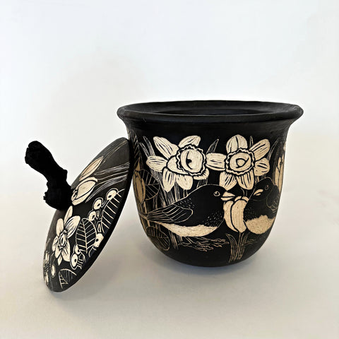 Black and white ceramic lidded vessel with a grapevine handle and sgraffito scenes of crocuses, birds, and other plants by Carolyn Blazeck at Cottage Curator - Sperryville VA Art Gallery