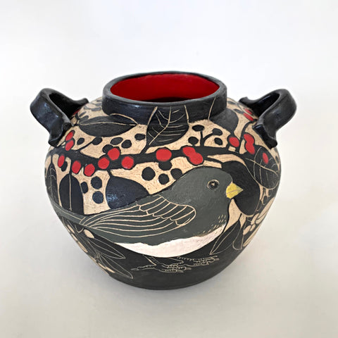 Black and white stoneware vessel with sgraffito carved images of Juncos and berries, with red and yellow painted details and red interior by Carolyn Blazeck at Cottage Curator - Sperryville VA