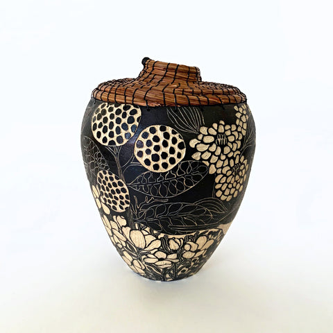 Black and white ceramic vessel with pine needle rim and lid showing plants, carved in sgraffito by Carolyn Blazeck, at Cottage Curator - Sperryville VA Art Gallery