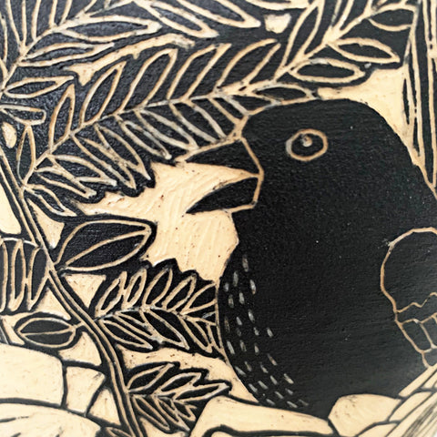 Detail of bird from black terra sigillata vessel with pine needle edge with birds in sgraffito by Carolyn Blazeck at Cottage Curator - Sperryville VA Art Gallery