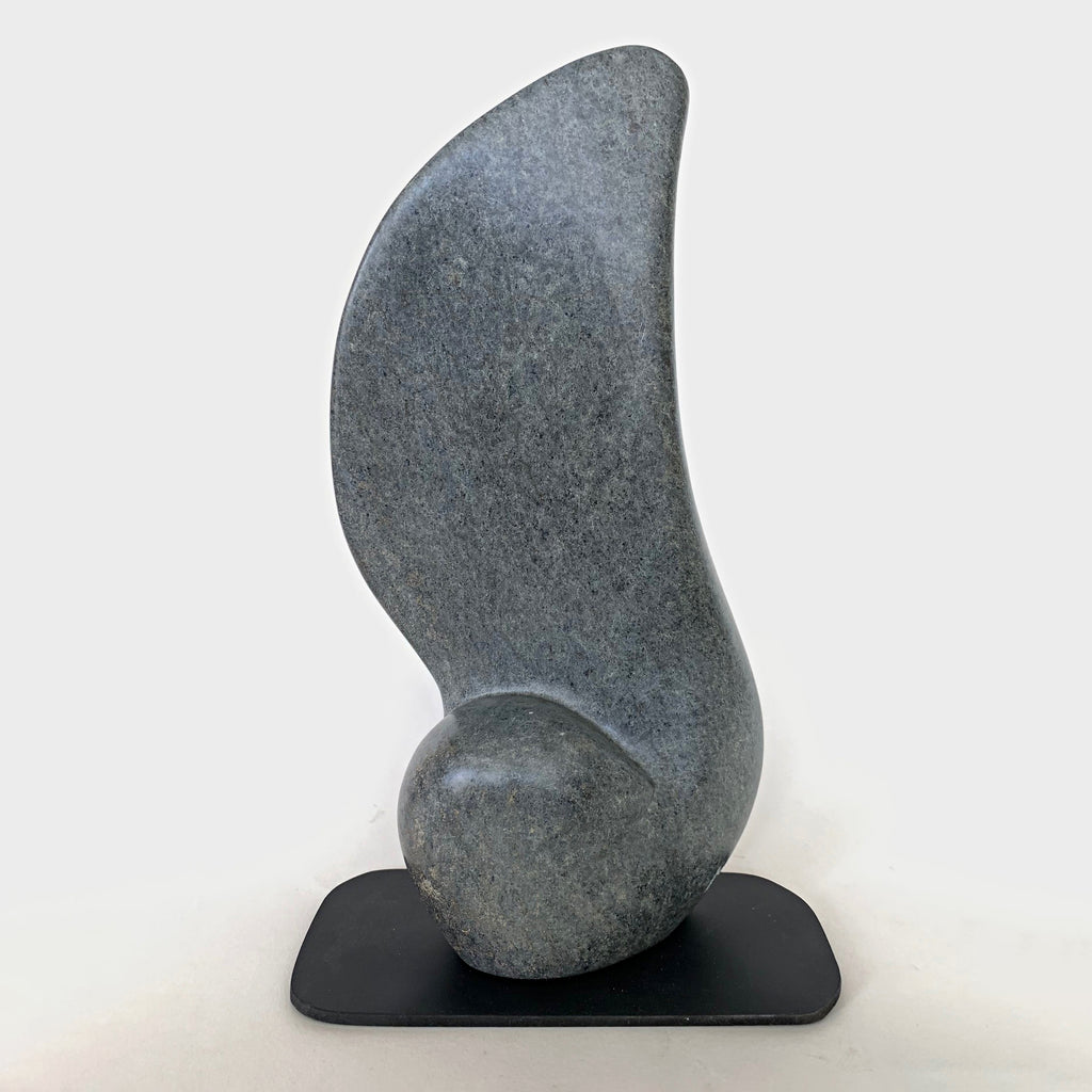 Gray Soapstone sculpture with black base in the shape of a large rounded feather or wing by Robert Bouquet at Cottage Curator - Sperryville VA Art Gallery