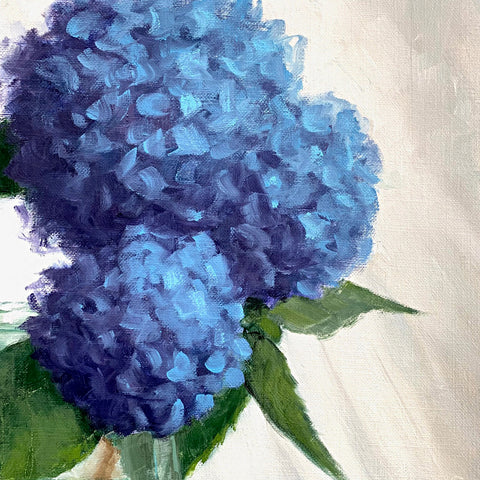 Detail of flowers in still life painting of a vase of blue hydrangeas on a tabletop with white cloth background by Kathy Chumley at Cottage Curator - Sperryville VA Art Gallery