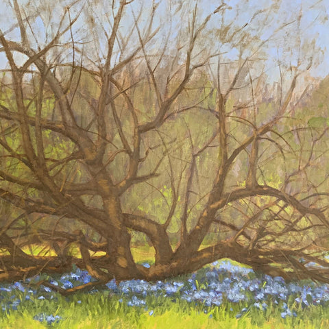 Detail of Oil painting of landscape with budding tree and blue wildflowers in the foreground with forest behind by Kathy Chumley at Cottage Curator - Sperryville VA Art Gallery