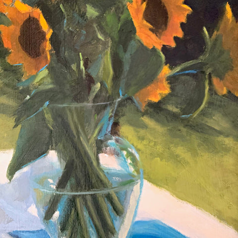 Detail of still life with vase of sunflowers on a table set outdoors with white tablecloth and blue linens by Kathy Chumley at Cottage Curator - Sperryville VA Art Gallery