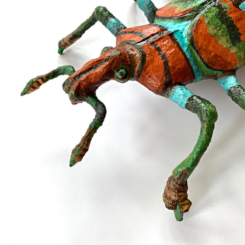 Beetle sculpture made with mixed media in black, green blue and orange by Joan Danziger at Cottage Curator Art Gallery - Sperryville Virginia