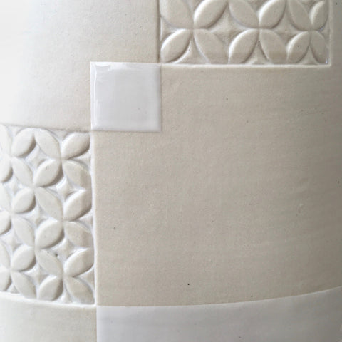 Detail of white porcelain vessel with rectangular patches of carved patterns by Yoshi Fujii at Cottage Curator - Sperryville VA Art Gallery