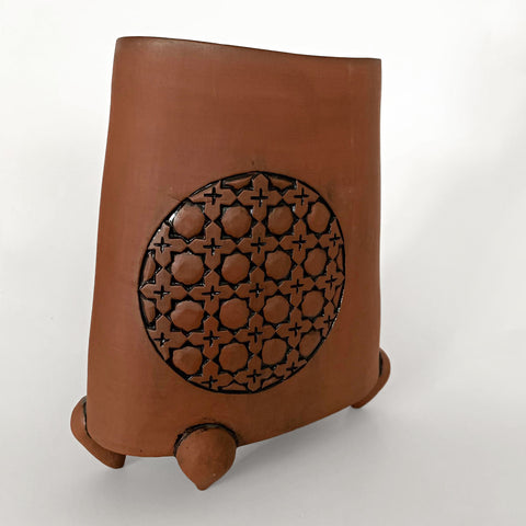 Stoneware vessel in natural tan clay color with carved patterned circles and three feet by Yoshi Fujii at Cottage Curator - Sperryville VA Art Gallery