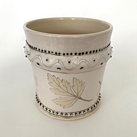 Stoneware vessel with leaves and black trim detailing and cream glaze by D.D. Lecky at Cottage Curator - Sperryville VA Art Gallery