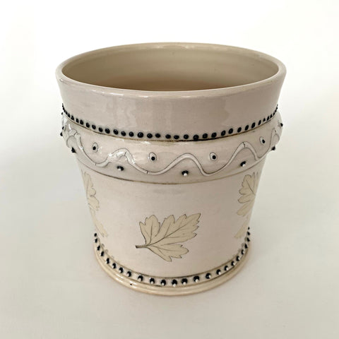 Stoneware vessel with leaves and black trim detailing and cream glaze by D.D. Lecky at Cottage Curator - Sperryville VA Art Gallery