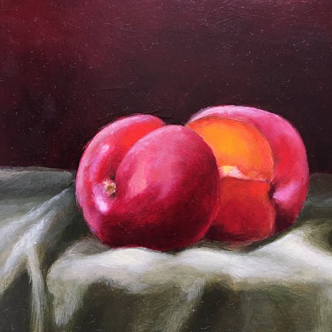 Detail of long, narrow still life with green tablecloth against a dark red background and red apricots by Davette Leonard at Cottage Curator - Sperryville VA Art Gallery