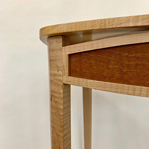 Detail of Two-tone wooden triangular table by fine furniture maker Bob Lucking at Cottage Curator Art Gallery