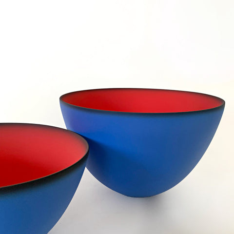 Close-up detail photo of a pair of bowls, one small and one larger, with royal blue exterior and red interior, made of earthenware by Thomas Marrinson at Cottage Curator - Sperryville VA Art Gallery