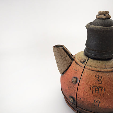 Detail view of industrial ceramic teapot with rivets by Steve Palmer