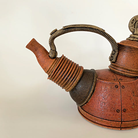 Detail of brown/orange clay teapot with mechanical, steampunk style by Steve Palmer at Cottage Curator - Sperryville VA Art Gallery