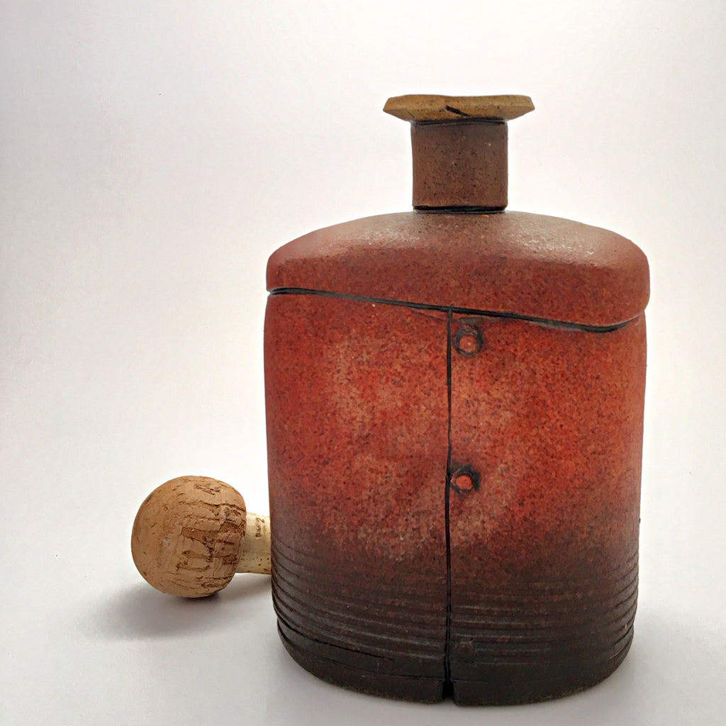 Red ceramic industrial flask vessel with seams by artist Steve Palmer