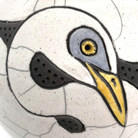 Detail of Black and white raku-fired vase with two pairs of egrets with yellow eyes and beaks by Robin Rodgers at Cottage Curator - Sperryville VA Art Gallery