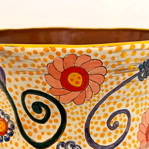 Detail of Ceramic vessel with polka dots and organic flowers and vines painted in bright colors by Sara Schneidman at Cottage Curator - Sperryville VA Art Gallery