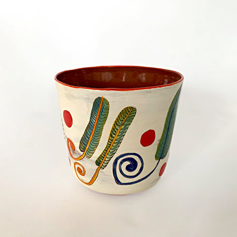 Ceramic pot with yellow, green, blue and purple plants and red polka dots with clay interior by Sara Schneidman at Cottage Curator - Sperryville VA Art Gallery
