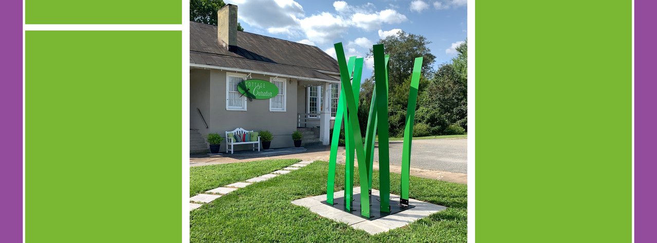 Front of Cottage Curator with Michael Bednar's Bamboo Forest in front